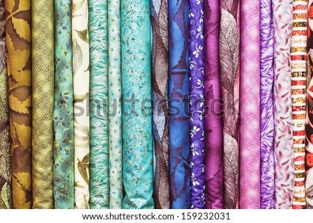 Rolls of colorful fabric as a vibrant background image