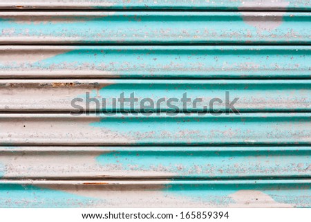 Blue rusty corrugated metal sheet as a background