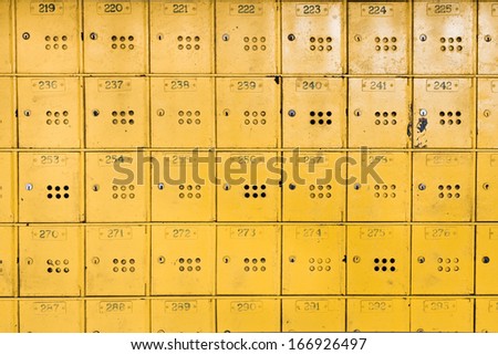Yellow individual metal postal boxes in Mauritius