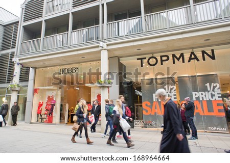 BURY ST EDMUNDS, UK - DECEMBER 27, 2013: Shoppers walk past high street stores in the Arc shopping complex after Christmas.