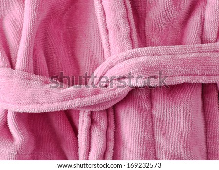 Close up of the tie belt on a pink dressing gown