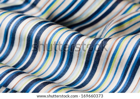 Close up of folded striped material with shallow depth of field