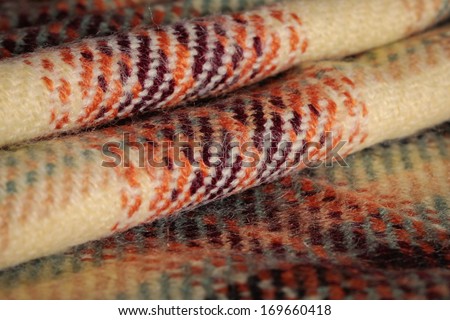 Folded wool tartan material as a background image