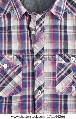 Checked purple casual man\'s shirt with details of buttons