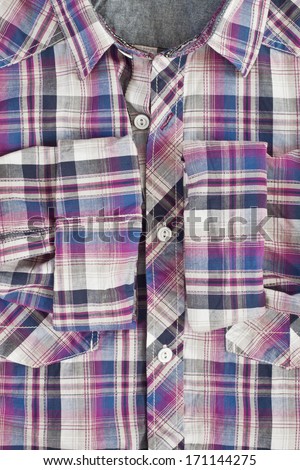 Checked purple casual man\'s shirt with details of buttons and sleeves