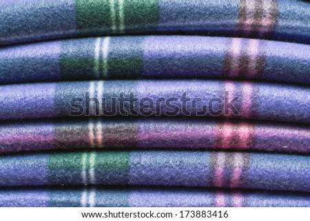 Folded tartan blanket as a background image