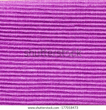 Macro of textured purple fabric as a background