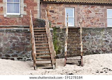 Steps from the rear of beach side cottages onto the sand