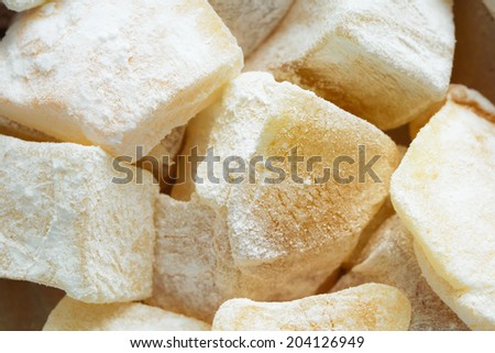 Pieces of lemon turkish delight with icing sugar