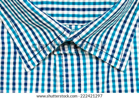 Collar of a blue checked casual shirt