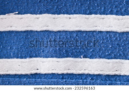 White seams on blue fabric
