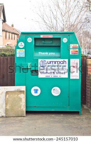 CAMBRIDGE, UK - JANUARY 24, 2015: A collection bin for second hand clothes and shoes in a carpark in Cambridge, for an Islamic charity.