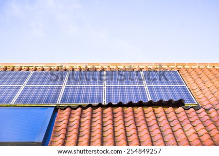 Modern solar panels on a tiled roof