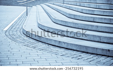 Curved concrete steps as an abstract in blue tones
