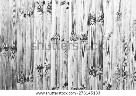 Weathered fence panels as a background image in black and white