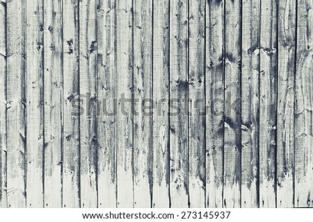 Weathered fence panels as a background image in black and white