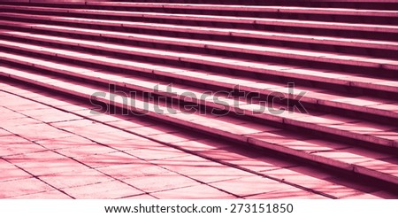 Stone steps in detail as an abstract pattern in red monochrome