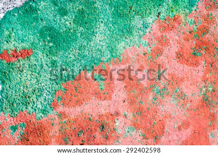 Red and green painted stone as a background image