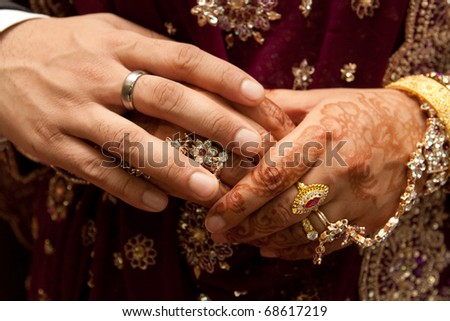 stock photo Close up of Asian couple's hands at a wedding 