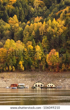 Lake houses in a beautiful autumn in Romania on the Bicaz Lake