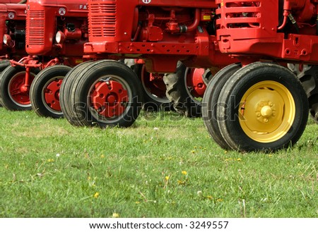 the front ends of a row of farm tractors