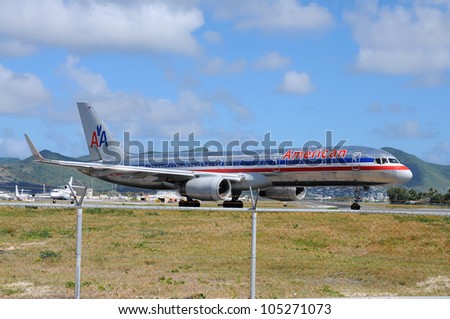 ST. MAARTEN -JANUARY 28: American Airlines on Princess Juliana airport in St. Maarten on January 28, 2011. It is the world\'s fifth largest airline in passenger miles transported and operating revenues