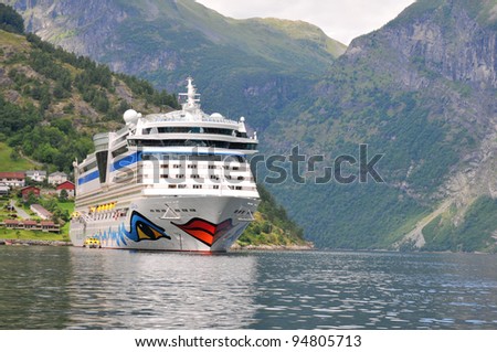 GEIRANGER, NORWAY-AUGUST 5: Cruise ship anchored in Geiranger fjord, Gieranger, Norway on August 5, 2010. The AIDAluna belongs to the AIDA cruises company. It is 252 m long, has passenger capacity of 2050, 15 decks, 1096 cabins