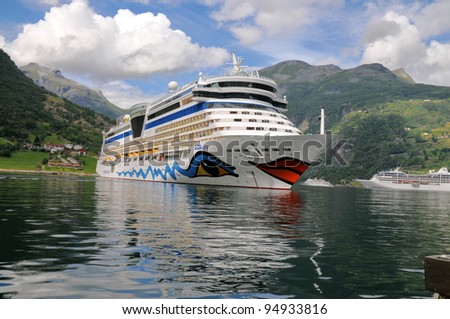 GEIRANGER, NORWAY-AUGUST 5: Cruise ship anchored in Geiranger fjord, Gieranger, Norway on August 5, 2010. The AIDA luna  is 252 m long, has passenger capacity of 2050, 15 decks, 1096 cabins