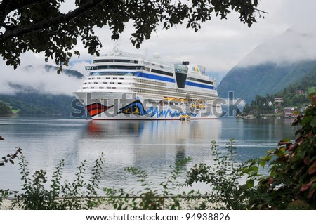 ULWIK, NORWAY-AUGUST 18: Cruise ship anchored in Ulwik fjord in Ulwik, Norway on August 18, 2010 AIDA luna belongs to the AIDA cruises.252 m long, has passenger capacity of 2050, 15 decks, 1096 cabins