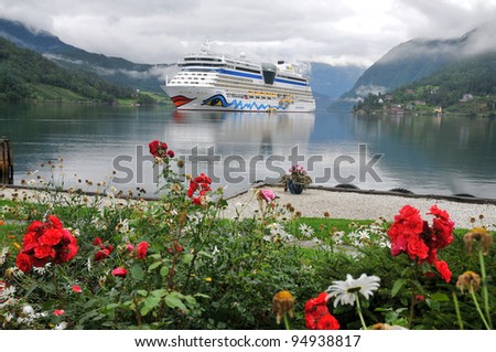 ULWIK, NORWAY-AUGUST 18: Cruise ship anchored in Ulwik fjord in Ulwik, Norway on August 18, 2010 AIDA luna belongs to the AIDA cruises.252 m long, has passenger capacity of 2050, 15 decks, 1096 cabins