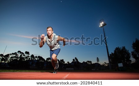 Male fitness model training for sprinting on an athletic track