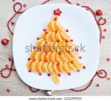 Tangerine Christmas tree - fun food idea for kids party, beautiful New Year food background