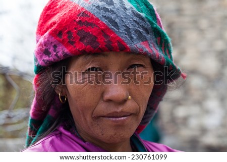 MANANG, NEPAL - 11 MAY, 2014: An unidentified Nepali village woman from Manang in HImalayas