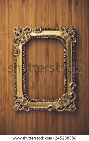 vintage portrait frame on wooden background