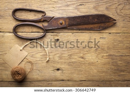Old scissors on wood background