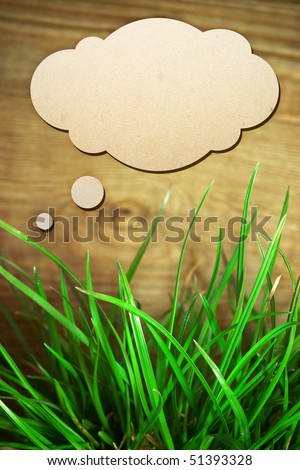 grass on a background of wood texture and funny cloud