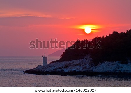 Beautiful Sea Sunset. Red Sun, Mountain, Deep Sea. High quality stock photo.