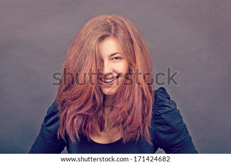 Positive Colorful Studio Portrait Of Young Happy Smiling Beauty Fashion Model On Black Back. Young Positive Woman Posing In Studio. Success Style.
