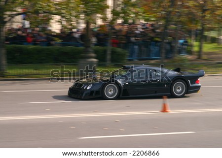 Pure black power race car takeing a tour on the roads of Bucharest