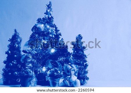 Blue christmas post card with christmas trees and other decoration (very useful as postcards background)