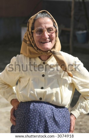 Portrait of an romanian peasant woman in spring sun