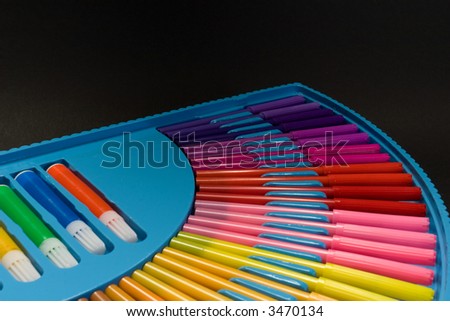 Colorful blue box with drawing pencils