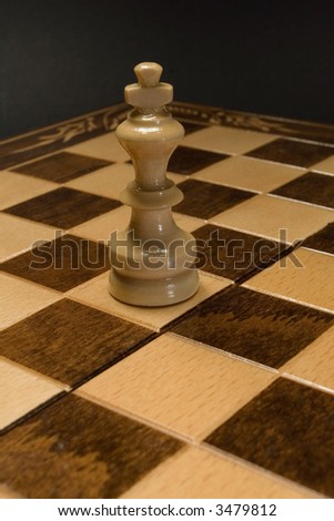 Winning white chess king on the game board