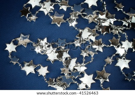 Christmas silver stars on blue background