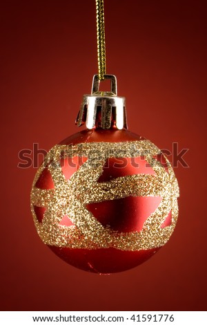 Red christmas globe with sparkly gold decorations