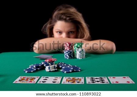 Very beautiful woman playing texas hold\'em poker