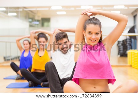 Group of friends working out at the gym