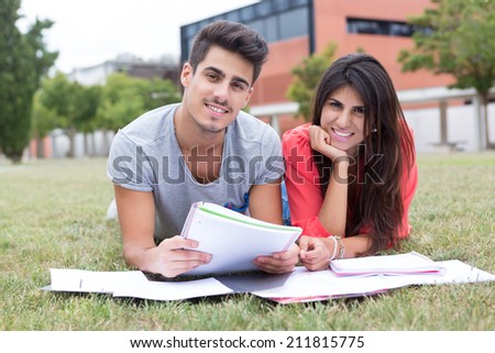 Couple of happy students at the university campus