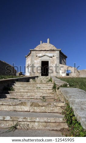 Path to a old church, isolated in blue sky