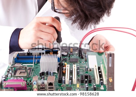 Computer engineer working on a old motherboard
